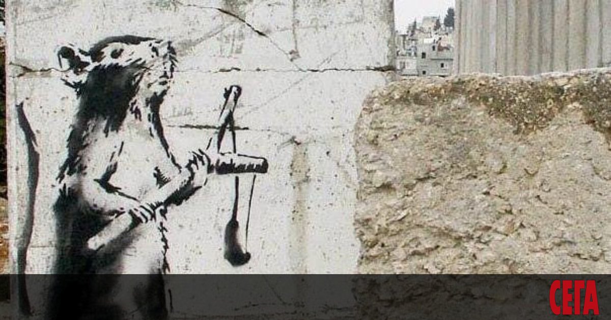 Творба на британския графити артист Банкси, нарисувана на бетонната стена
