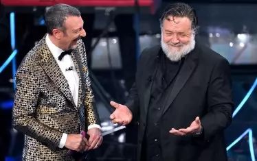 Артистичният директор и водещ в последните пет издания на "Сан Ремо" с кинозвездата Ръсел Кроу.